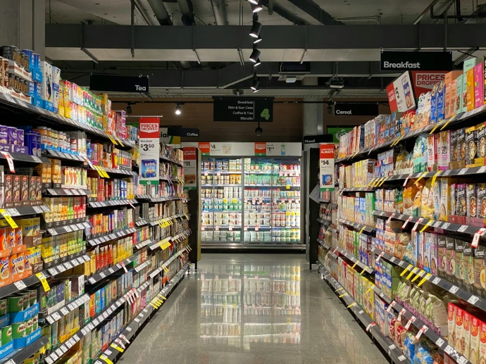 grocery store aisle with stocked shelves